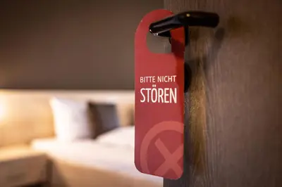 Ein Bett oder Betten in einem Zimmer der Unterkunft Brauereigasthof Hofmark