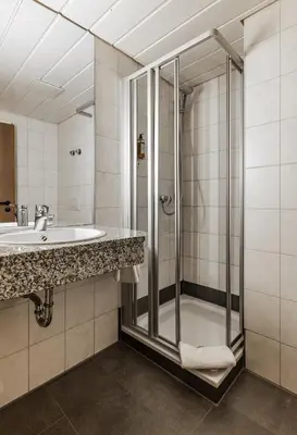 Ein Badezimmer in der Unterkunft Brauereigasthof Hofmark