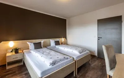 Ein Bett oder Betten in einem Zimmer der Unterkunft Brauereigasthof Hofmark