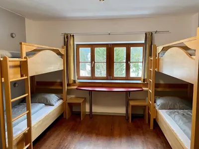 Ein Bett oder Betten in einem Zimmer der Unterkunft BLSV Sportcamp direkt am Kurvenlift!