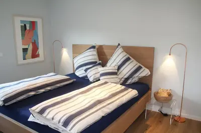 Ein Bett oder Betten in einem Zimmer der Unterkunft Ruheoase mit Bergblick im Zentrum Murnaus