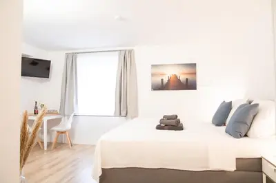 Ein Bett oder Betten in einem Zimmer der Unterkunft Gästezimmer ROSS