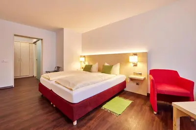 Ein Bett oder Betten in einem Zimmer der Unterkunft Zum Turm - Apartments und Gästezimmer