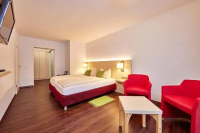Ein Bett oder Betten in einem Zimmer der Unterkunft Zum Turm - Apartments und Gästezimmer
