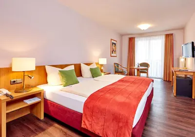 Ein Bett oder Betten in einem Zimmer der Unterkunft Zum Turm - Apartments und Gästezimmer