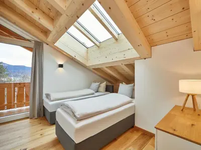Ein Bett oder Betten in einem Zimmer der Unterkunft Fewo Sterntaler DG mit Bergblick
