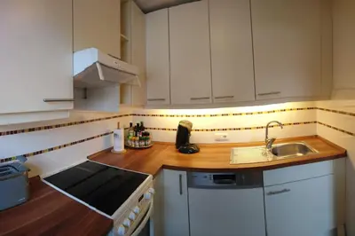 Küche/Küchenzeile in der Unterkunft Wohnung direkt am Tegernsee mit XL-Terrasse