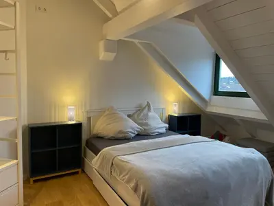 Ein Bett oder Betten in einem Zimmer der Unterkunft Gemütliches Loft