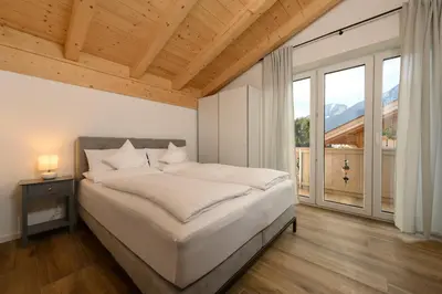 Ein Bett oder Betten in einem Zimmer der Unterkunft Alpjuwel