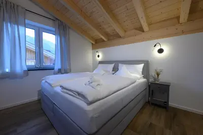 Ein Bett oder Betten in einem Zimmer der Unterkunft Alpjuwel