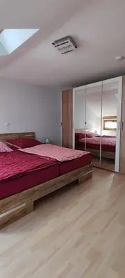 Ein Bett oder Betten in einem Zimmer der Unterkunft Schöne helle Ferienwohnung