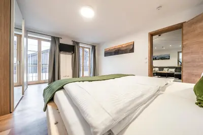 Ein Bett oder Betten in einem Zimmer der Unterkunft Alpenrose Ferienwohnungen