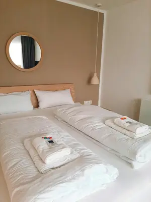 Ein Bett oder Betten in einem Zimmer der Unterkunft Ferienwohnung Bergzauber mit Balkon & Bergblick