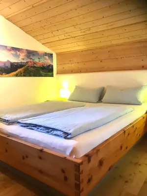 Ein Bett oder Betten in einem Zimmer der Unterkunft Ferienwohnung Zugspitze