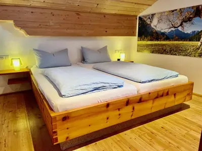 Ein Bett oder Betten in einem Zimmer der Unterkunft Ferienwohnung Zugspitze
