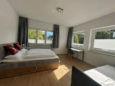 Ein Bett oder Betten in einem Zimmer der Unterkunft DAS LUDWIG - Haus HOCHLAND