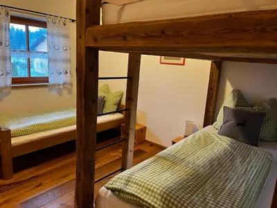 Ein Bett oder Betten in einem Zimmer der Unterkunft Thallerhof
