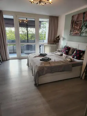 Ein Bett oder Betten in einem Zimmer der Unterkunft Apartment Ferienwohnung modern nähe Altstadt Landshut