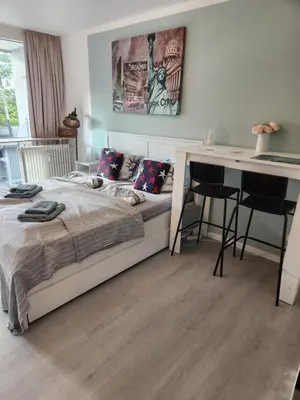 Ein Bett oder Betten in einem Zimmer der Unterkunft Apartment Ferienwohnung modern nähe Altstadt Landshut