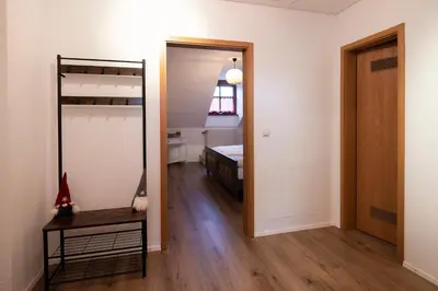 Ein Bett oder Betten in einem Zimmer der Unterkunft Ferienwohnung Am Riedfeld