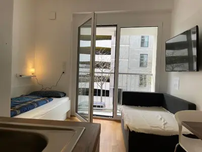 Ein Bett oder Betten in einem Zimmer der Unterkunft Myroom Business Apartment Nähe Messe München
