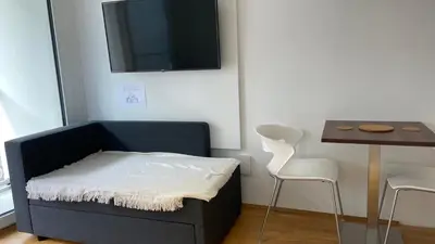 Ein Bett oder Betten in einem Zimmer der Unterkunft Myroom Business Apartment Nähe Messe München