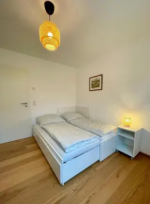Ein Bett oder Betten in einem Zimmer der Unterkunft Ferienwohnung Schmied von Almertsham