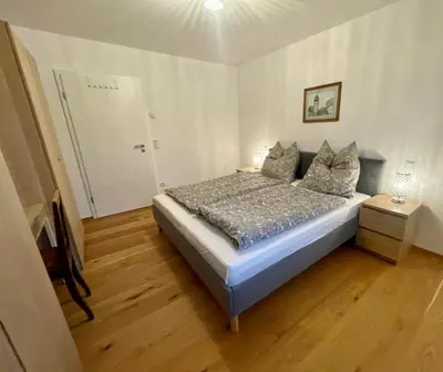 Ein Bett oder Betten in einem Zimmer der Unterkunft Ferienwohnung Schmied von Almertsham