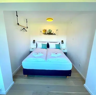 Ein Bett oder Betten in einem Zimmer der Unterkunft Großzügige FeWo mit Bergblick am Tegernsee