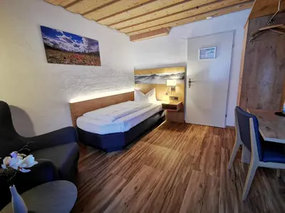Ein Bett oder Betten in einem Zimmer der Unterkunft Gasthof & Hotel Zur Post