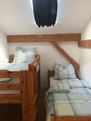 Ein Bett oder Betten in einem Zimmer der Unterkunft Ferienwohnungen Gruber