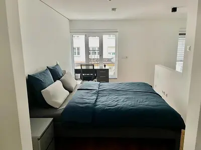 Ein Bett oder Betten in einem Zimmer der Unterkunft Modern Apartment in the center of Munich