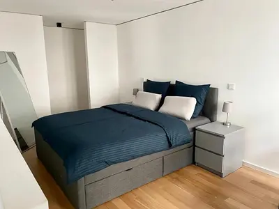 Ein Bett oder Betten in einem Zimmer der Unterkunft Modern Apartment in the center of Munich