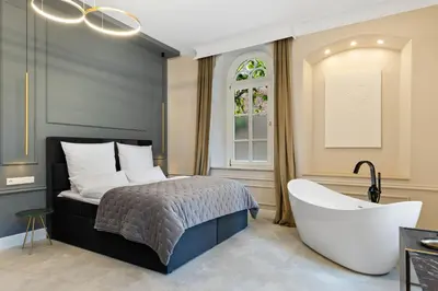 Ein Bett oder Betten in einem Zimmer der Unterkunft BOUTIQUE ROOMS I Luxus Suite I Center I Boxspring