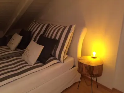Ein Bett oder Betten in einem Zimmer der Unterkunft Chiemgau-LOFT zwischen Seenzauber und Gipfelglück