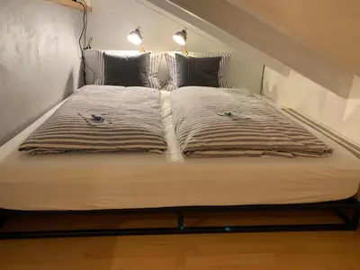 Ein Bett oder Betten in einem Zimmer der Unterkunft Chiemgau-LOFT zwischen Seenzauber und Gipfelglück