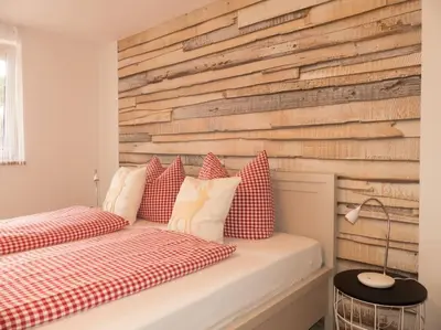 Ein Bett oder Betten in einem Zimmer der Unterkunft Ferienwohnung Alpenglück