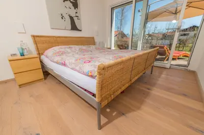 Ein Bett oder Betten in einem Zimmer der Unterkunft Helle Wohnung mit Bergblick & eigener Terrasse