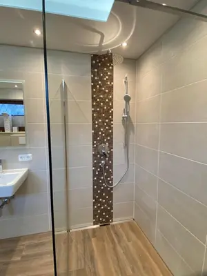 Ein Badezimmer in der Unterkunft Ferienhaus Wildbarren - Alpenmagie Suites