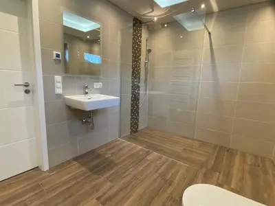 Ein Badezimmer in der Unterkunft Ferienhaus Wildbarren - Alpenmagie Suites
