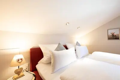 Ein Bett oder Betten in einem Zimmer der Unterkunft Fuchsbau