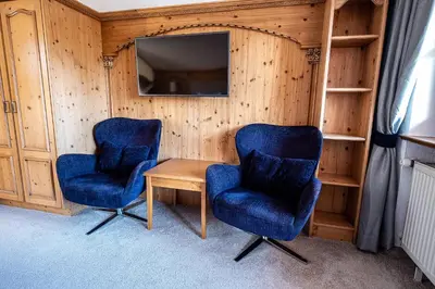 Ein Sitzbereich in der Unterkunft SL Hotel