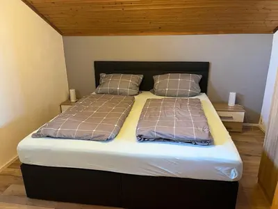 Ein Bett oder Betten in einem Zimmer der Unterkunft NEU! FeWo Mansi in Chiemgau