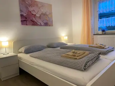 Ein Bett oder Betten in einem Zimmer der Unterkunft Ferienwohnung Augsburg 2