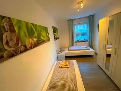 Ein Bett oder Betten in einem Zimmer der Unterkunft Ferienwohnung Augsburg 2