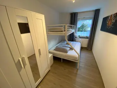 Ein Bett oder Betten in einem Zimmer der Unterkunft Ferienwohnung Augsburg 2