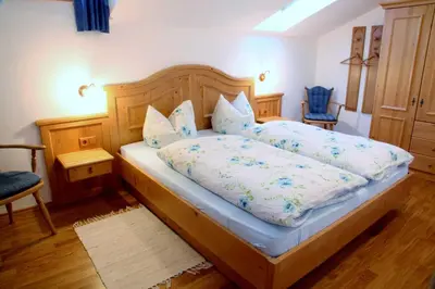 Ein Bett oder Betten in einem Zimmer der Unterkunft Gästehaus Kleinbuch