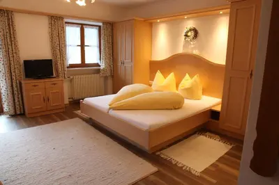 Ein Bett oder Betten in einem Zimmer der Unterkunft Gästehaus Kleinbuch