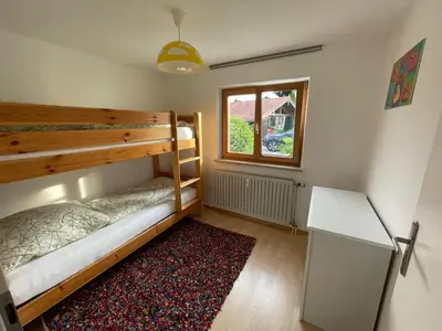 Ein Bett oder Betten in einem Zimmer der Unterkunft Ferienwohnung Horrer