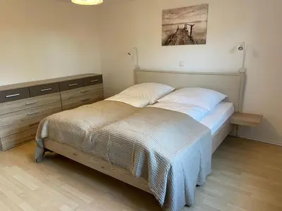 Ein Bett oder Betten in einem Zimmer der Unterkunft Ferienwohnung Horrer